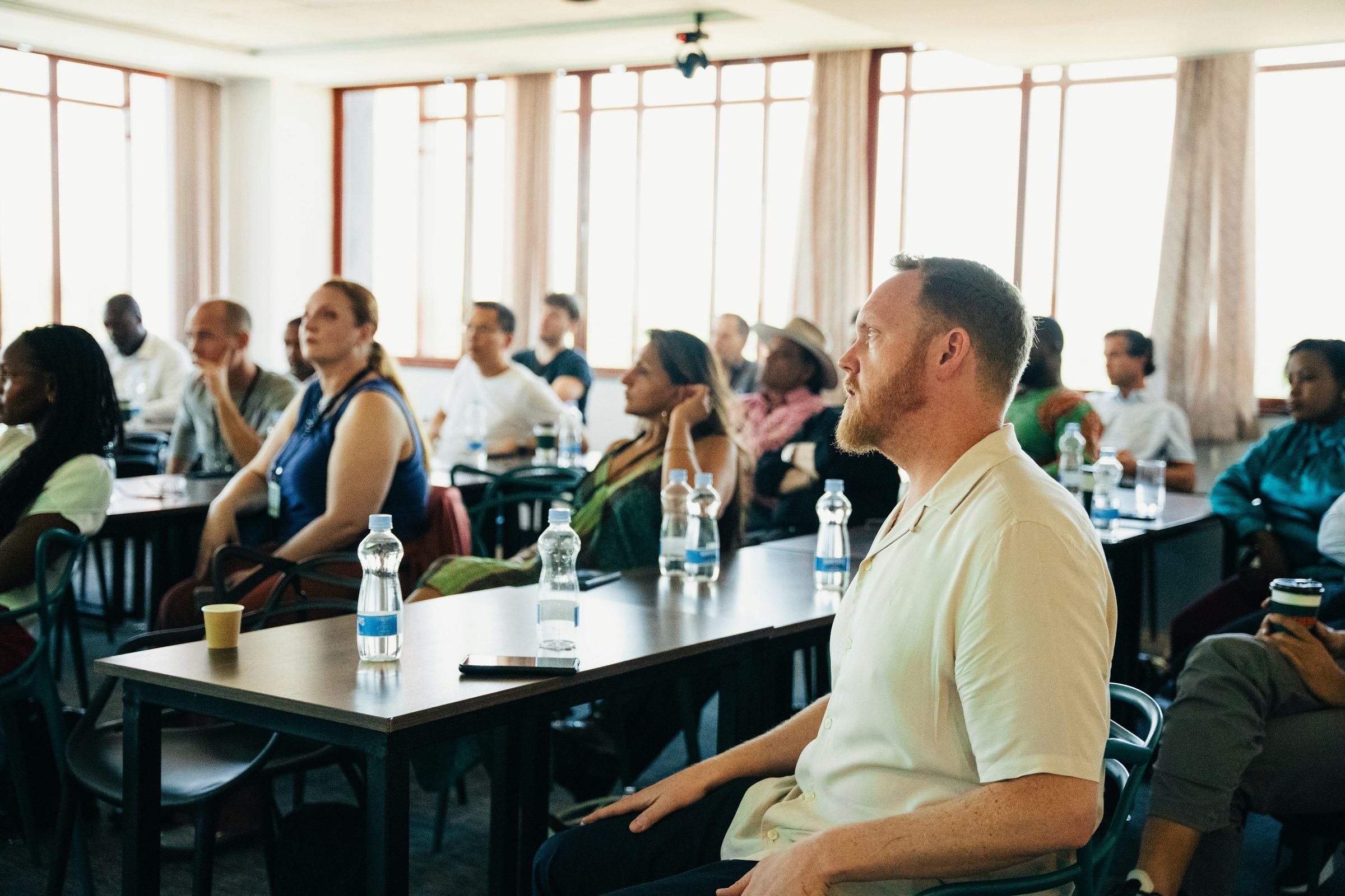 Audience at an in-person conference. Photo: Dwayne joe / Unsplash