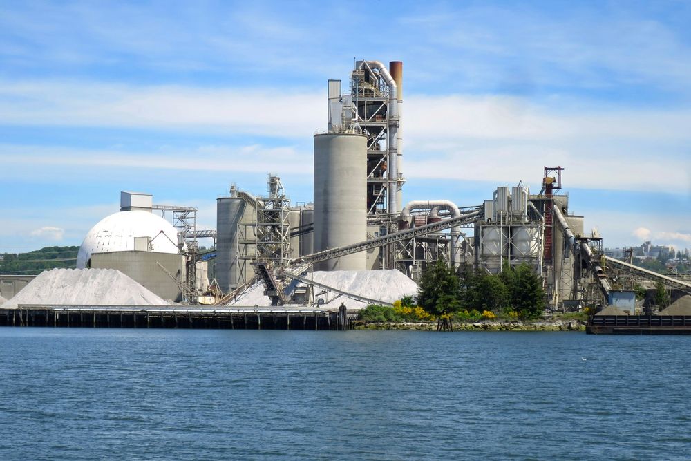 Cement works beside the water. Photo: Chris Linnett / Unsplash