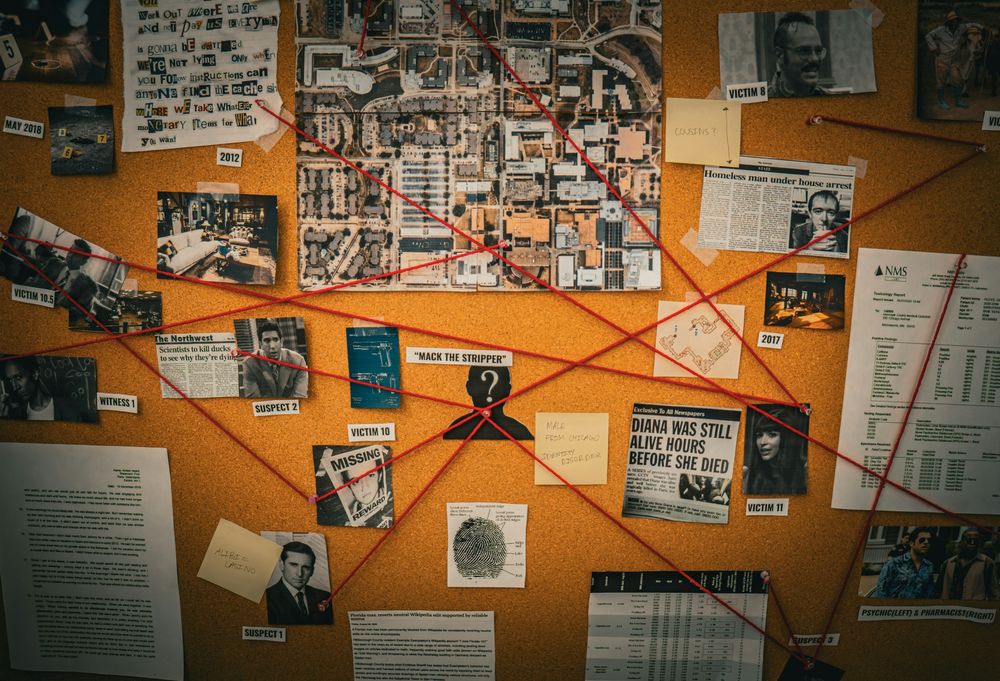 Investigation board with red string connecting photos and documents. Photo: Veer Mickey Shah / Unsplash