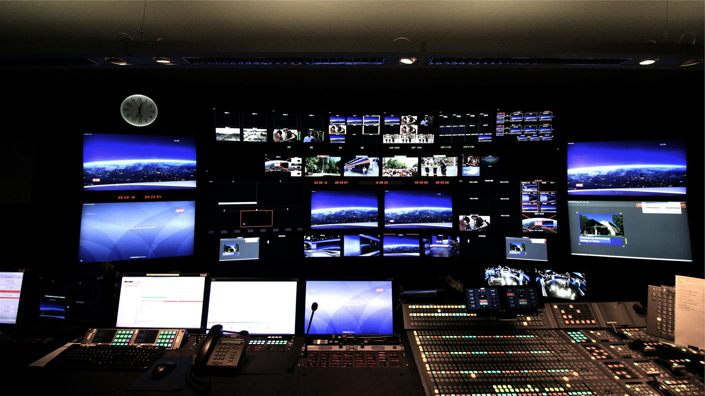 Broadcast control room screens. Photo: Frederic Köberl / Unsplash